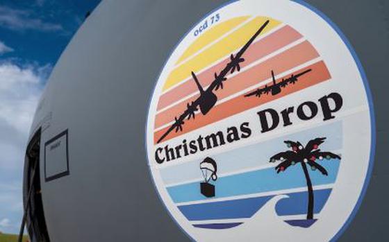 Photo Of a fighter plane with paint of christmas drop.