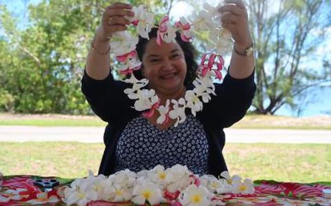 Photo Of Eleanor Mesa smiles with a lei.