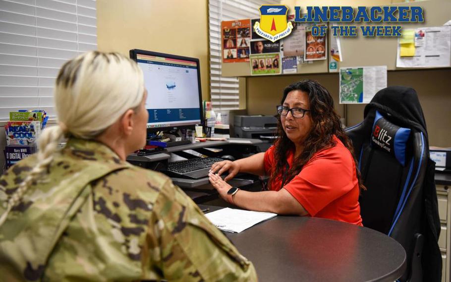 Carly A. Macias, community recreation manager with the 36th Force Support Squadron, consults with an Airman at Andersen Air Force Base, Guam, Aug. 24, 2022. Macias manages and administers a comprehensive and diverse year around recreation program and various recreation facilities to include, Outdoor Recreation, information, ticket and tours and special events. (U.S. Air Force photo illustration by A1C Allison)