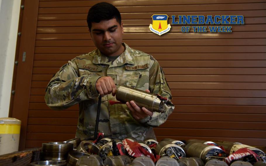 U.S. Air Force Senior Airman. Lionardo Sanchez, munitions maintenance crew chief with the 36th Munitions Squadron, sets the delay in a FMU 152 bomb fuse, at Andersen Air Force Base, Guam, May 18, 2022. The FMU-152 is a programmable bomb fuse with a multi-function Hard/Soft Target fusing system. (U.S. Air Force photo illustration by A1C Allison Martin)