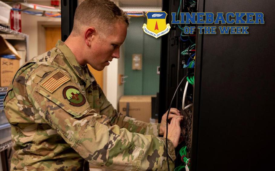 U.S. Air Force Staff Sgt. Barry East, the noncommissioned officer in charge of health information systems assigned to the 36th Healthcare Operations Squadron, works on a server at Andersen Air Force Base, Guam, Oct. 5, 2022. East oversees three contractors, supporting 13 clinics and 36,000 annual appointments. (U.S. Air Force photo illustration by Airman 1st Class Emily Saxton)