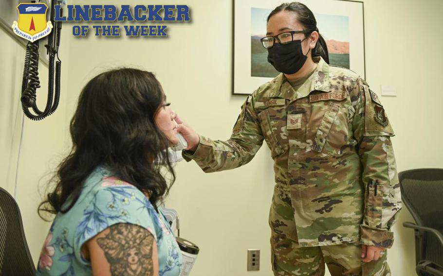 U.S. Air Force Staff Sgt. Jennifer Sangil, noncommissioned officer in charge of women’s health and pediatrics assigned to the 36th Healthcare Operations Squadron, takes a patients temperature at Andersen Air Force Base, Guam, Jan. 25, 2023. The Team Andersen Linebacker of the Week recognizes outstanding enlisted, officer, civilian and total force personnel who have had an impact on achieving Team Andersen’s mission, vision and priorities. (U.S. Air Force photo illustration by Airman 1st Class Breanna Christ