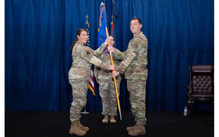 Col. Sheri Kraus, 36th Mission Support Group commander, presents the guidon to Maj. Kevin Brady, incoming 36th Security Forces Squadron commander, during an Assumption of Command Ceremony at Andersen Air Force Base, Guam, July 12, 2024.