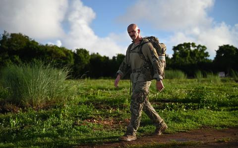 Photo Of U.S. Air Force Tech. Sgt. Timothy Bridges, flight sergeant of the 36th Security Forces Squadron’s Alpha Flight, completes the last leg of the Andersen EOD 2025 Norwegian Foot March at Andersen Air Force Base, Guam.