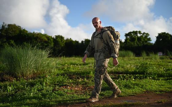 U.S. Air Force Tech. Sgt. Timothy Bridges, flight sergeant of the 36th Security Forces Squadron’s Alpha Flight, completes the last leg of the Andersen EOD 2025 Norwegian Foot March at Andersen Air Force Base, Guam.