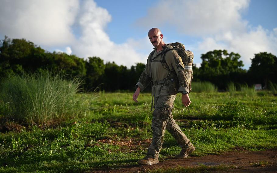 U.S. Air Force Tech. Sgt. Timothy Bridges, flight sergeant of the 36th Security Forces Squadron’s Alpha Flight, completes the last leg of the Andersen EOD 2025 Norwegian Foot March at Andersen Air Force Base, Guam.