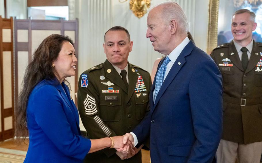 President Joe Biden greets Marlene Barretto of Guam, and her husband Command Sgt. Maj. Phil Barretto of the U.S. Military Academy at West Point, at The White House.