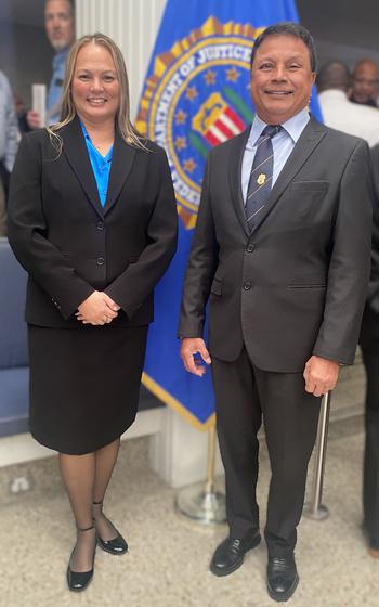 Capt. Barbara Tayama, left, is joined by Guam Customs and Quarantine Agency Director Ike Peredo after her graduation from the Federal Bureau of Investigation (FBI) National Academy Session 292.