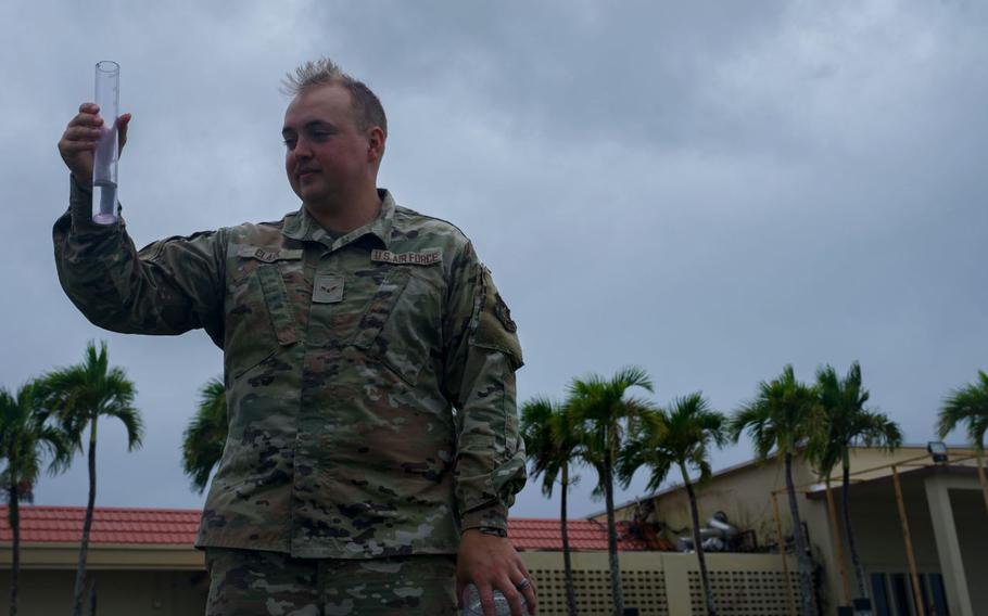 U.S. Air Force Airman 1st Class Nicholas Clark, 36th Operations Support Squadron weather apprentice and forecaster, inspects a rain gauge to measure precipitation during exercise Resolute Force Pacific 2025, at Andersen Air Force Base, Guam, July 25, 2025. REFORPAC, part of the first-in-a-generation Department-Level Exercise series, trains Airmen to operate in a contested, dynamic environment while executing real-time force projection and joint interoperability.