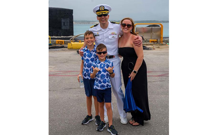 Cmdr. Andrew Domina, commanding officer of the Los Angeles-class fast-attack submarine USS Springfield (SSN 761), and his family pose for a photo after Springfield’s return to Guam from deployment, Jan. 9. Springfield is capable of supporting various missions, including anti-submarine warfare, anti-ship warfare, strike warfare and intelligence, surveillance reconnaissance. (U.S. Navy photo by Lt. Eric Uhden)