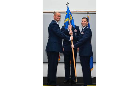 Photo Of U.S. Air Force Col. Richard McElhaney, 36th Contingency Response Group commander, passes the guidon to the incoming commander of the 36th Contingency Response Squadron, Lt. Col. Jeffrey Schmidt, at Andersen Air Force Base, Guam, June 10, 2024.