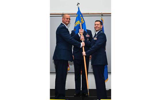 Photo Of U.S. Air Force Col. Richard McElhaney, 36th Contingency Response Group commander, passes the guidon to the incoming commander of the 36th Contingency Response Squadron, Lt. Col. Jeffrey Schmidt, at Andersen Air Force Base, Guam, June 10, 2024.