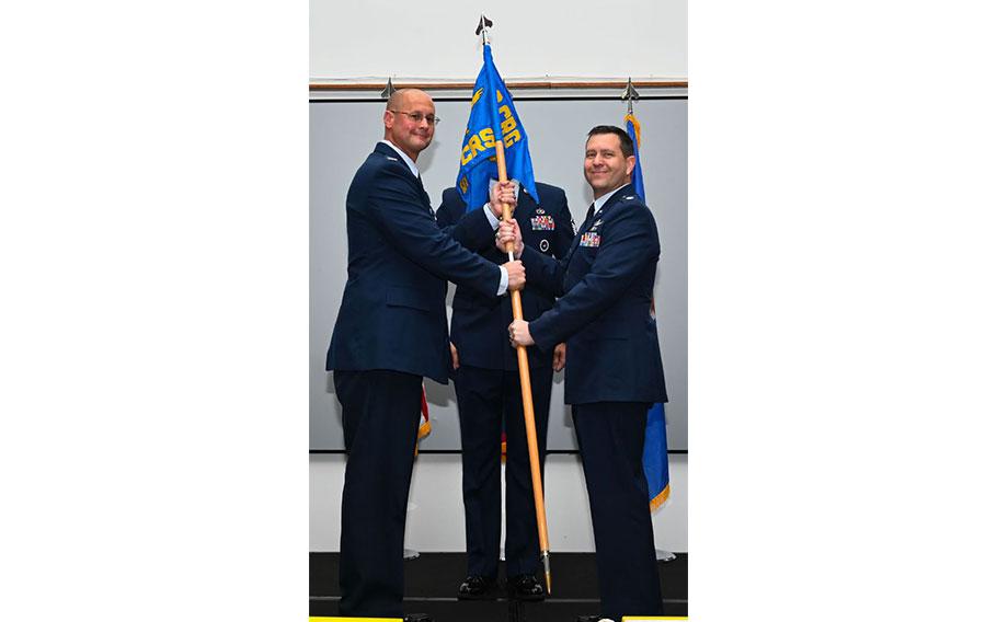 U.S. Air Force Col. Richard McElhaney, 36th Contingency Response Group commander, passes the guidon to the incoming commander of the 36th Contingency Response Squadron, Lt. Col. Jeffrey Schmidt, at Andersen Air Force Base, Guam, June 10, 2024.