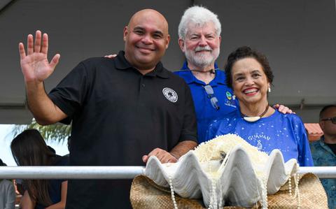 Photo Of From left, Lt. Gov. Josh Tenorio, Jeff Cook, the First Gentleman of Guam, and Gov. Lou Leon Guerrero attend the 81st Guam Liberation Day Parade in Hagåtña, Guam.