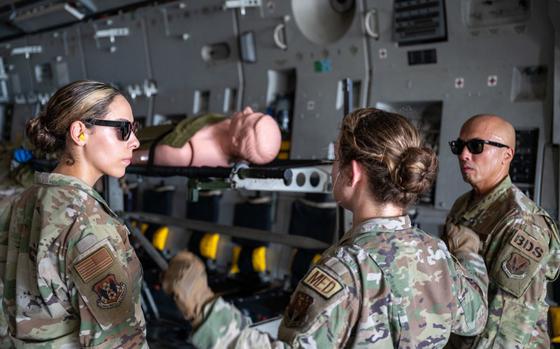 Photo Of U.S. Air Force 1st Lt. Courtney Kalb, 624th Aerospace Medicine Flight, Clinical Nurse gives instructions on how members should load simulated patients onto stantions on Andersen Air Force Base, Guam, Sep. 06, 2024.