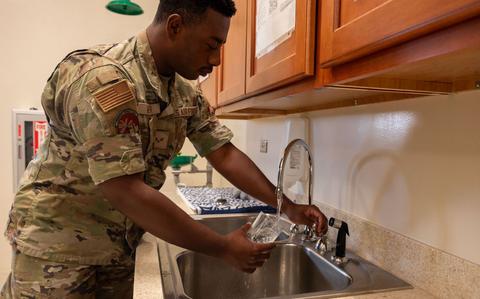 Photo Of U.S. Air Force Senior Airman William Greer, 36th Operational Medical Readiness Squadron bioenvironmental engineering journeyman, prepares to analyze water.