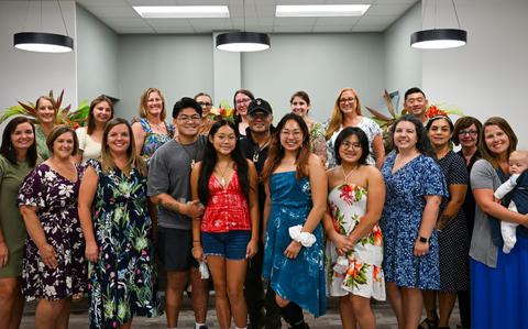 Photo Of Team Andersen Spouses’ Club and the Martinez Family pose for a group photo at Andersen Air Force Base, Guam.
