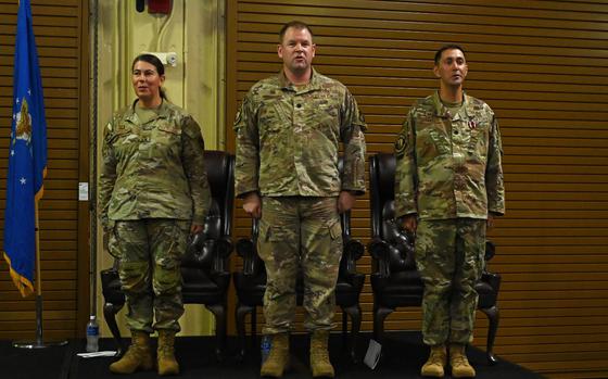 Photo Of Col. Sheri L. Kraus (left), 36th Mission Support Group commander, Lt. Col. Adam Burwinkle (mid), 36th Civil Engineer Squadron commander, and Lt. Col. Marc Johansen, 36th CES outgoing commander, sing the Air Force song during the conclusion of the 36th CES change of command at Andersen Air Force Base, Guam, June 28, 2024.