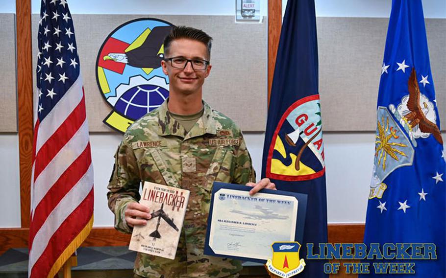 U.S. Air Force Senior Airman Alexander Lawrence, an aircraft hydraulic journeyman with the 734th Air Mobility Squadron, receives the Linebacker of the Week award at the 36th Wing, Andersen Air Force Base, Guam, Jan. 5, 2022. The Team Andersen Linebacker of the Week recognizes outstanding enlisted, officer, civilian and total force personnel who have had an impact on achieving Team Andersen’s Mission, Vision and Priorities. (U.S. Air Force photo by Senior Airman Aubree Owens)