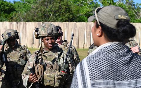 Photo Of U.S. Air Force Staff Sgt. Faasiu Faalata, 736th Security Forces Squadron warrior instructor, speaks to students after completion of NEXUS FORGE 2025 training exercises at Northwest Field, Andersen Air Force Base, Guam, Feb. 11, 2025. 