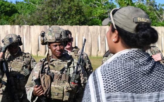 U.S. Air Force Staff Sgt. Faasiu Faalata, 736th Security Forces Squadron warrior instructor, speaks to students after completion of NEXUS FORGE 2025 training exercises at Northwest Field, Andersen Air Force Base, Guam, Feb. 11, 2025. 