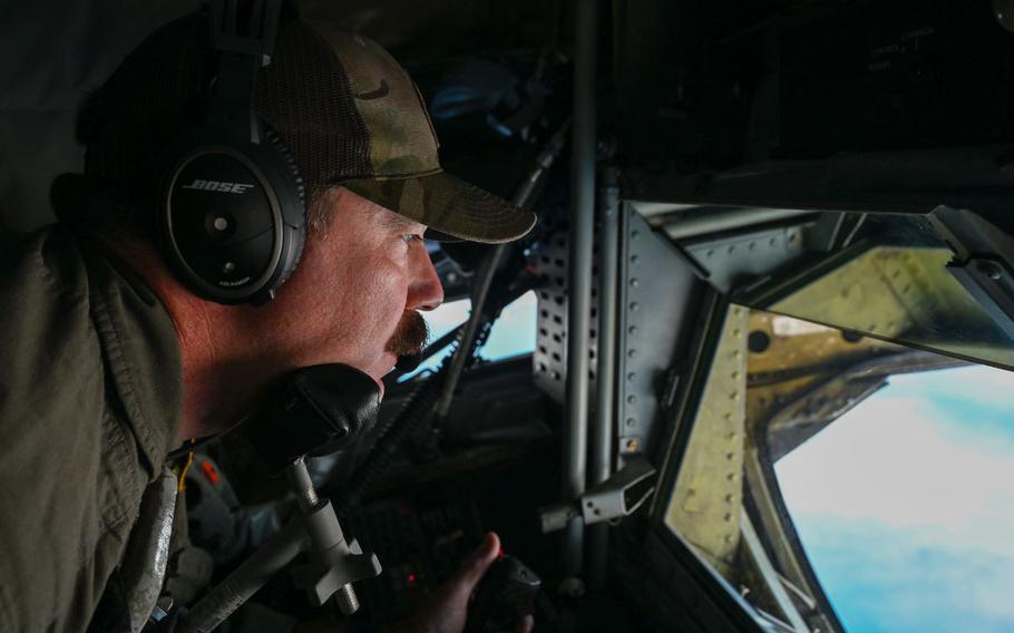 U.S. Air Force Tech. Sgt. Justin Campbell, 506th Expeditionary Air Refueling Squadron, boom operator, maneuvers a refueling boom during a mission over the Pacific Ocean.