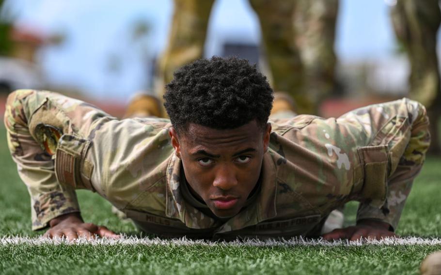 U.S. Air Force Airman 1st Class Kevin Mills, 374th Security Forces Squadron alarm monitor, Yokota Air Base, Japan, prepares to do hand release push-ups during the 2025 Advanced Combat Skills Assessment (ACSA) on Andersen Air Force Base, Guam.