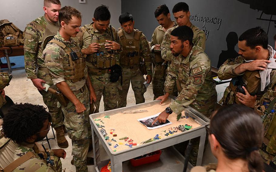 Staff Sgt. Emmanuel Nieves, 736th Security Forces Squadron commando warrior instructor, gives an operations order brief to Pacific Air Forces Security Forces and Munitions Airmen at the Pacific Regional Training Center – Andersen, Guam, Aug. 31, 2023. PACAF Airmen participated in the Commando Warrior program with the goal to enhance capability and interoperability in a deployed environment. (U.S. Air Force photo by Senior Airman Akeem K. Campbell)