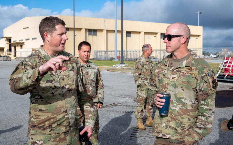 U.S. Air Force Col. Troy Pierce, commander of the 715th Air Mobility Operations Group, briefs U.S. Air Force Col. Brandon Shroyer, deputy commander of the 36th Wing, on what a Joint Inspection entails and its’ role in the cargo flow process on Andersen Air Force Base.