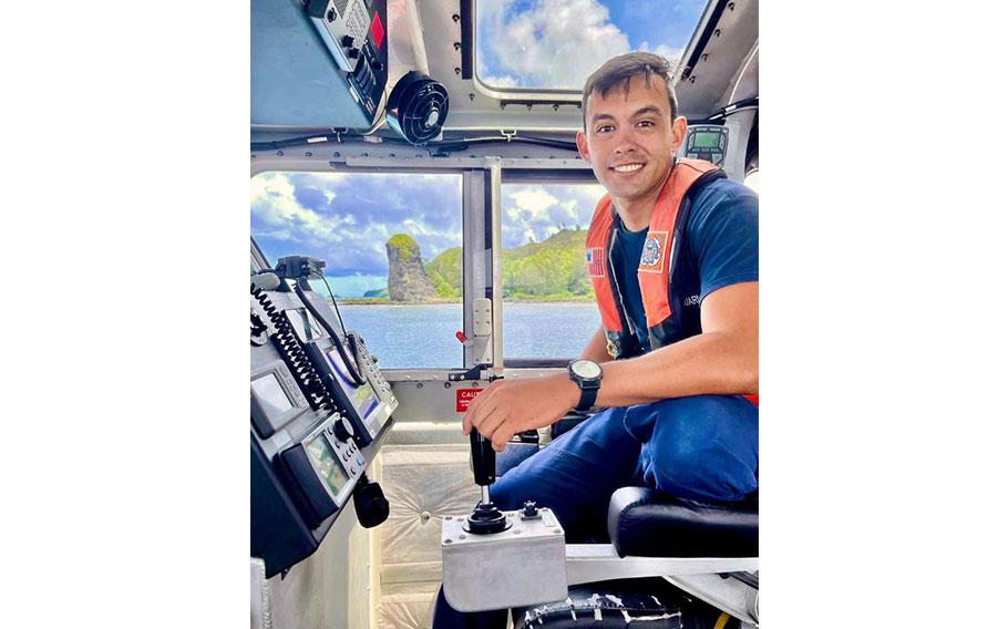 Petty Officer 2nd Class Will Naden, a boatswains mate with Station Apra Harbor, takes a moment for a photo while aboard a 45-foot Response Boat Medium off Inalahan, Guam, on Aug. 12, 2022.