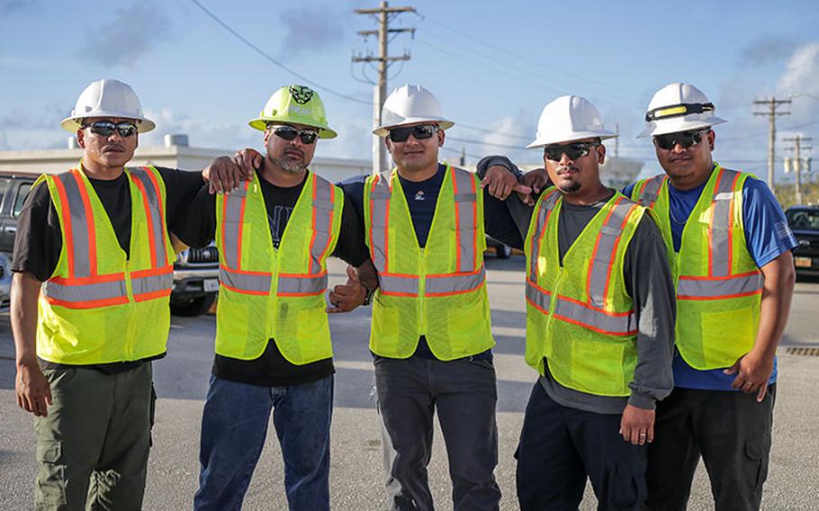 Guam National Guard recruit Jay Rideb, center, with this Commonwealth Utilities Corporation coworkers from neighboring Saipan, works with the Guam Power Authority to restore services in the wake of Typhoon Mawar, Guam, June 15, 2023. Typhoon Mawar moved through the area as a Category 4 storm on May 24, bringing hurricane-force winds, heavy rain, and high seas, marking the strongest storm to affect the island since Typhoon Pongsona in 2002. Photos courtesy of Guam National Guard Public Affairs