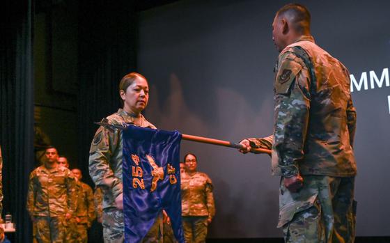 U.S. Air Force Col. Veronica Reyes, 254th Air Base Group commander, Guam Air National Guard, prepares to appoint Capt. Tommy Joe Rivera as the commander of the 254th Communications Flight (CF) during a ceremony on Andersen Air Force Base, Guam.
