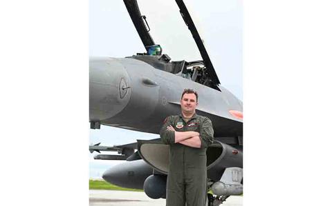 Photo Of U.S. Air Force Lt. Col. Jeffrey Entine, 40th Flight Test Squadron Air Combat Command Operational Flight Program Combined Test Force commander, poses with an F-16C aircraft during Exercise Resolute Force Pacific (REFORPAC) at Andersen Air Force Base, Guam.