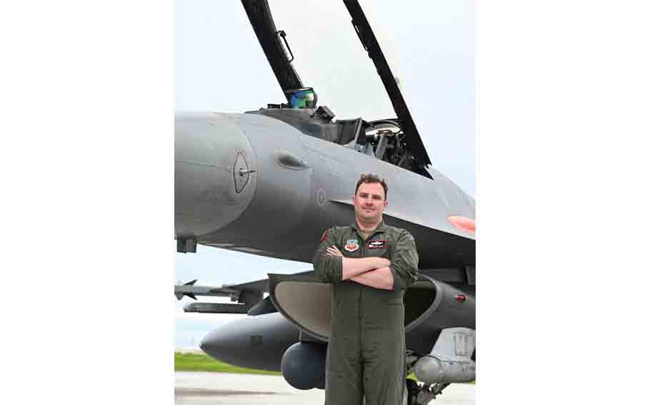 U.S. Air Force Lt. Col. Jeffrey Entine, 40th Flight Test Squadron Air Combat Command Operational Flight Program Combined Test Force commander, poses with an F-16C aircraft during Exercise Resolute Force Pacific (REFORPAC) at Andersen Air Force Base, Guam.
