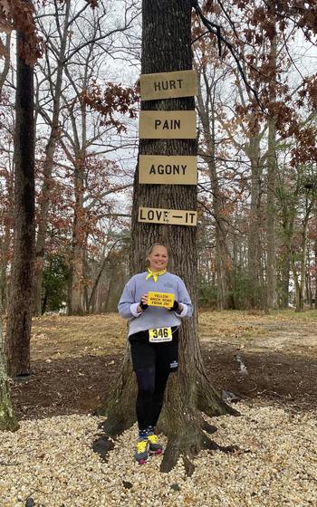 Capt. Barbara Tayama displays a yellow brick after completing the Federal Bureau of Investigation (FBI) National Academy’s (NA) challenging Yellow Brick Road obstacle course on Dec. 9, 2024 at the FBI Training Academy in Quantico, Va.