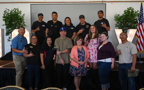 Photo Of 36th Force Support Squadron members pose for a photo with American comedian and actor, Jo Koy, at the Sunrise Conference Center on Andersen Air Force Base.