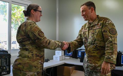 Photo Of U.S. Air Force Gen. Johnny Lamontagne, right, Air Mobility Command commander, recognizes U.S. Air Force Maj. Nichole Yang, AMC Medical Readiness Logistics branch chief, and the AMC surgeon general lead logistician and log planner, for her accomplishments in support of the U.S. Air Force’s 2025 Department-Level Exercise at Andersen Air Force Base, Guam.