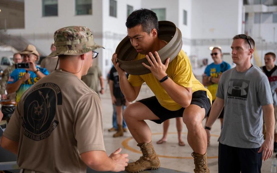 From left, Staff Sgt. Baylor Smith, SrA. Dingcheng Jin, and Staff Sgt. Jeffery Gundersen, all assigned to the 36th Maintenance Squadron, participate in the final challenge of the Maintenance Olympics at Andersen Air Force Base, Guam.