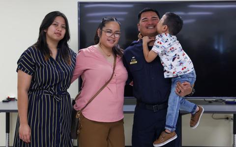 Photo Of Maj. John R. Lizama, newly promoted supervisory police officer with Marine Corps Base Camp Blaz, poses with family after his promotion to the rank of major on Naval Computer and Telecommunications Station, Guam, Feb. 27, 2024. 