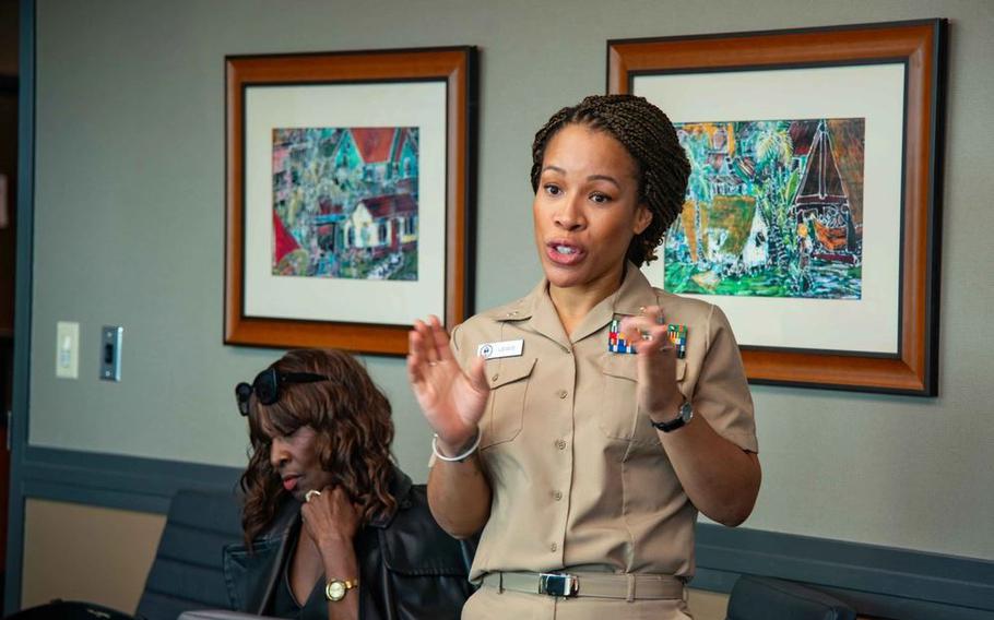 U.S. Navy Cmdr. Nneoma Lewis, associate director of mental health for Navy Medicine Readiness and Training Command Guam, gives a presentation about Naval Hospital Guam’s behavioral health services to Joint Region Marianas staff at JRM headquarters.