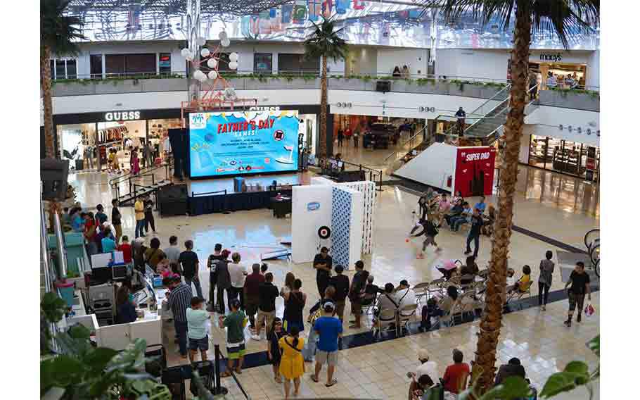 Attendees line up to play games for prizes at Micronesia Mall’s Father’s Day event in 2024.