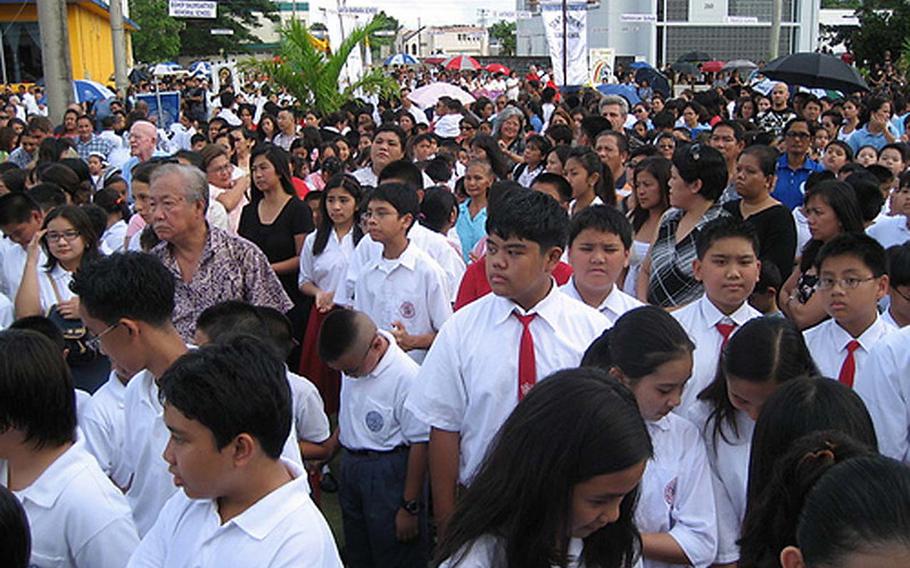 Santa Barbara Catholic School gather for the Santa Marian Kamalen procession.